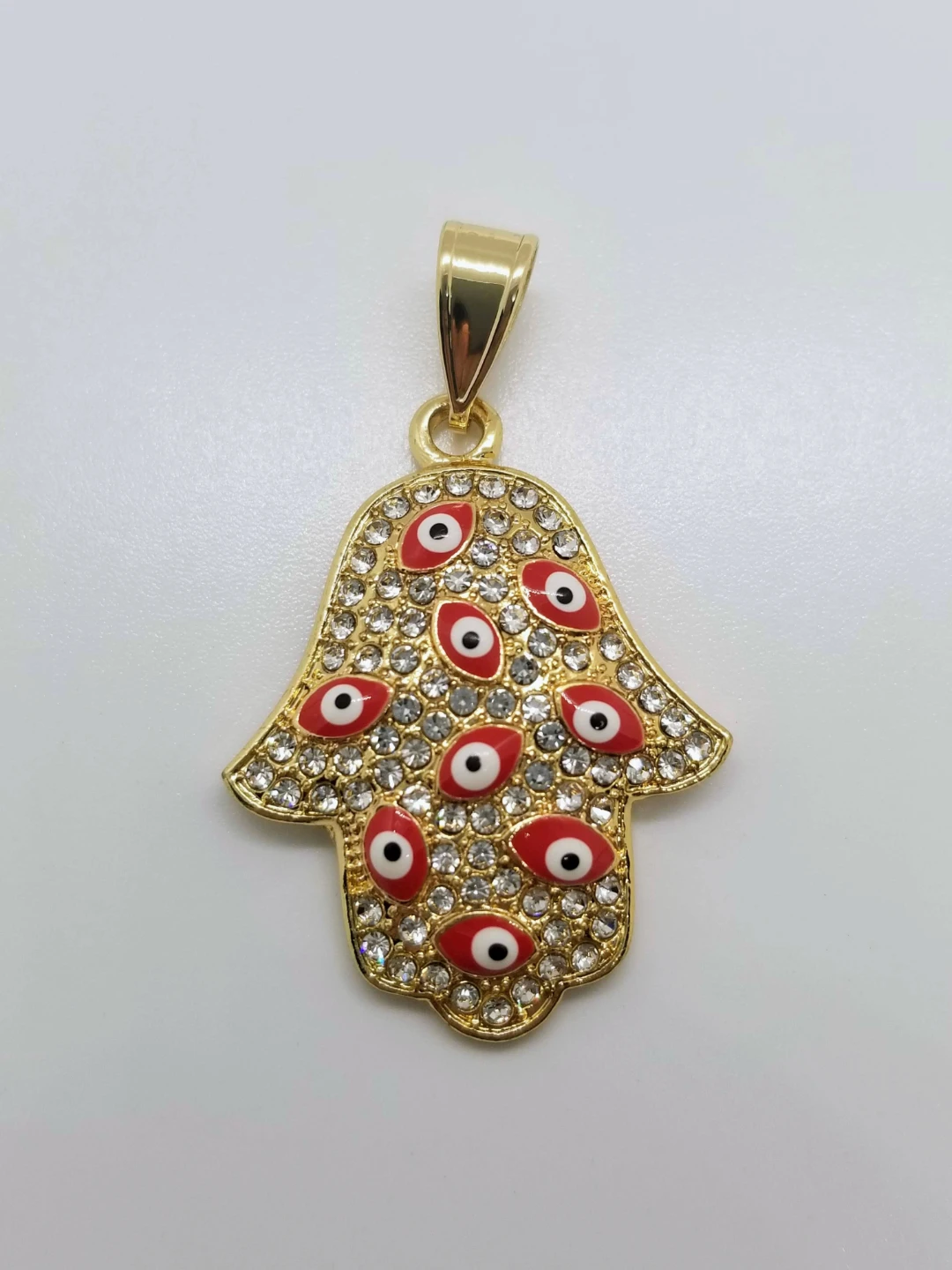 Gold Tone Hamsa Pendant with Red Eyes and Crystals