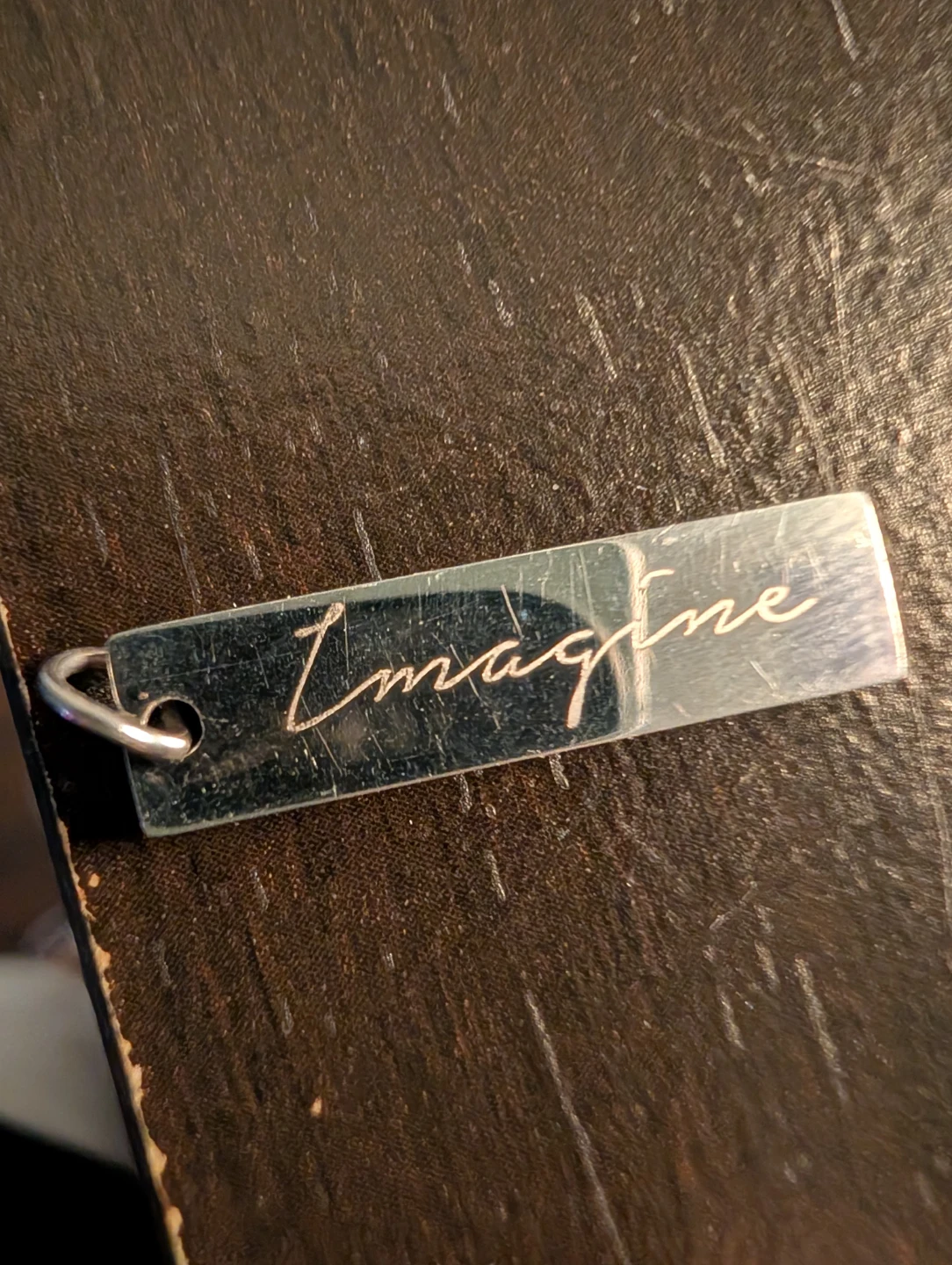 Silver coloured "Imagine" charm ⚽