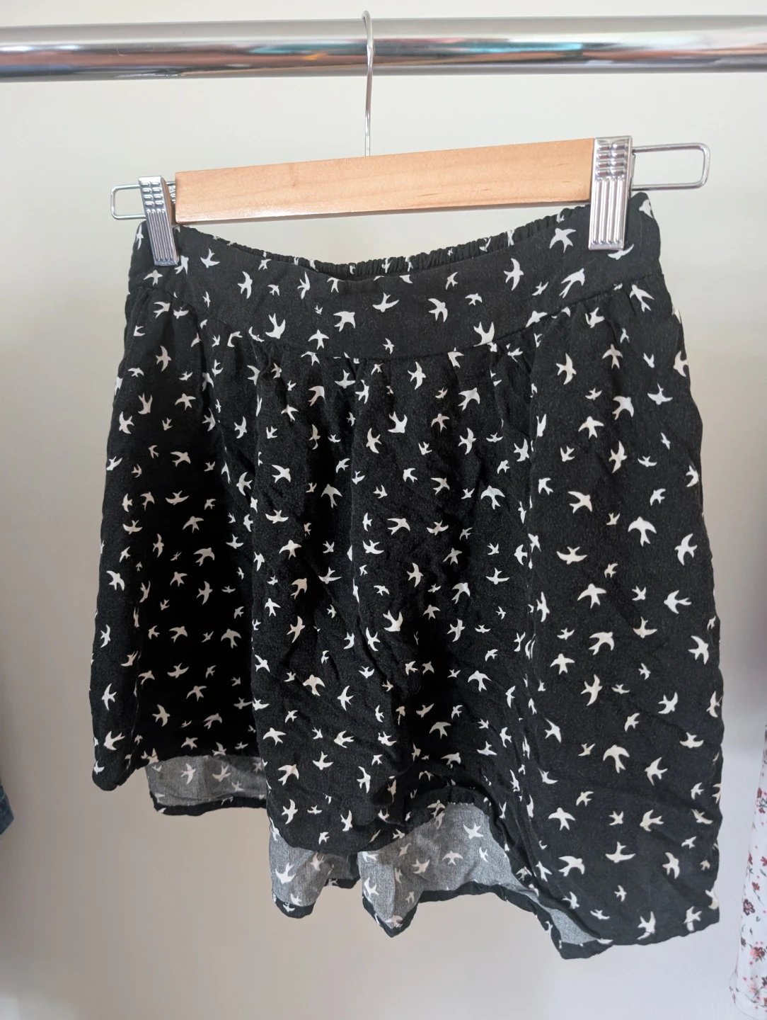 Black shorts with white bird print