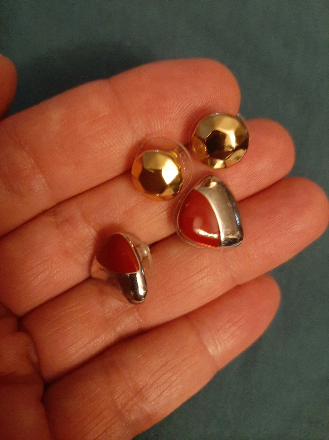 Gold color and Red Studs earrings.