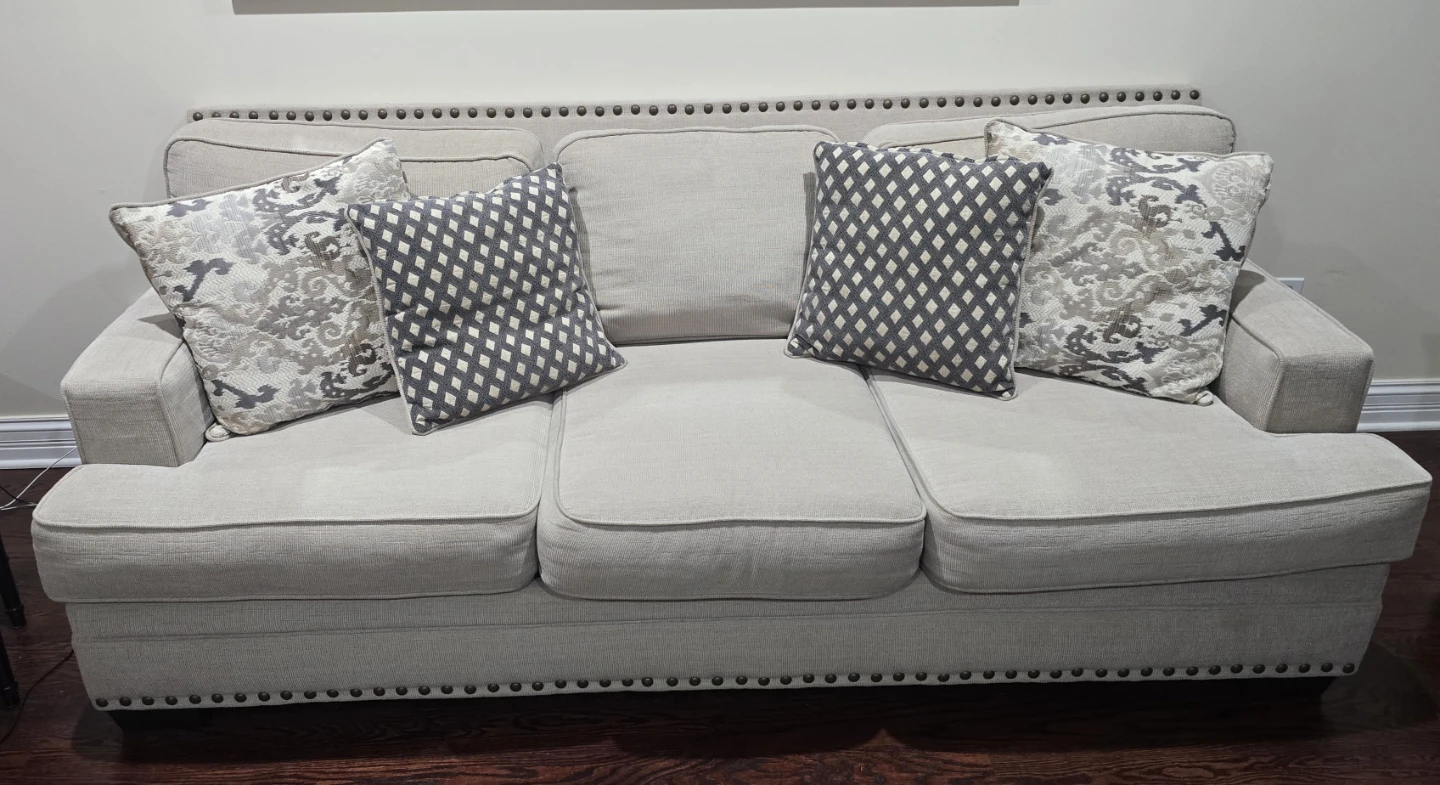 Light Beige Tufted Sofa with Throw Pillows