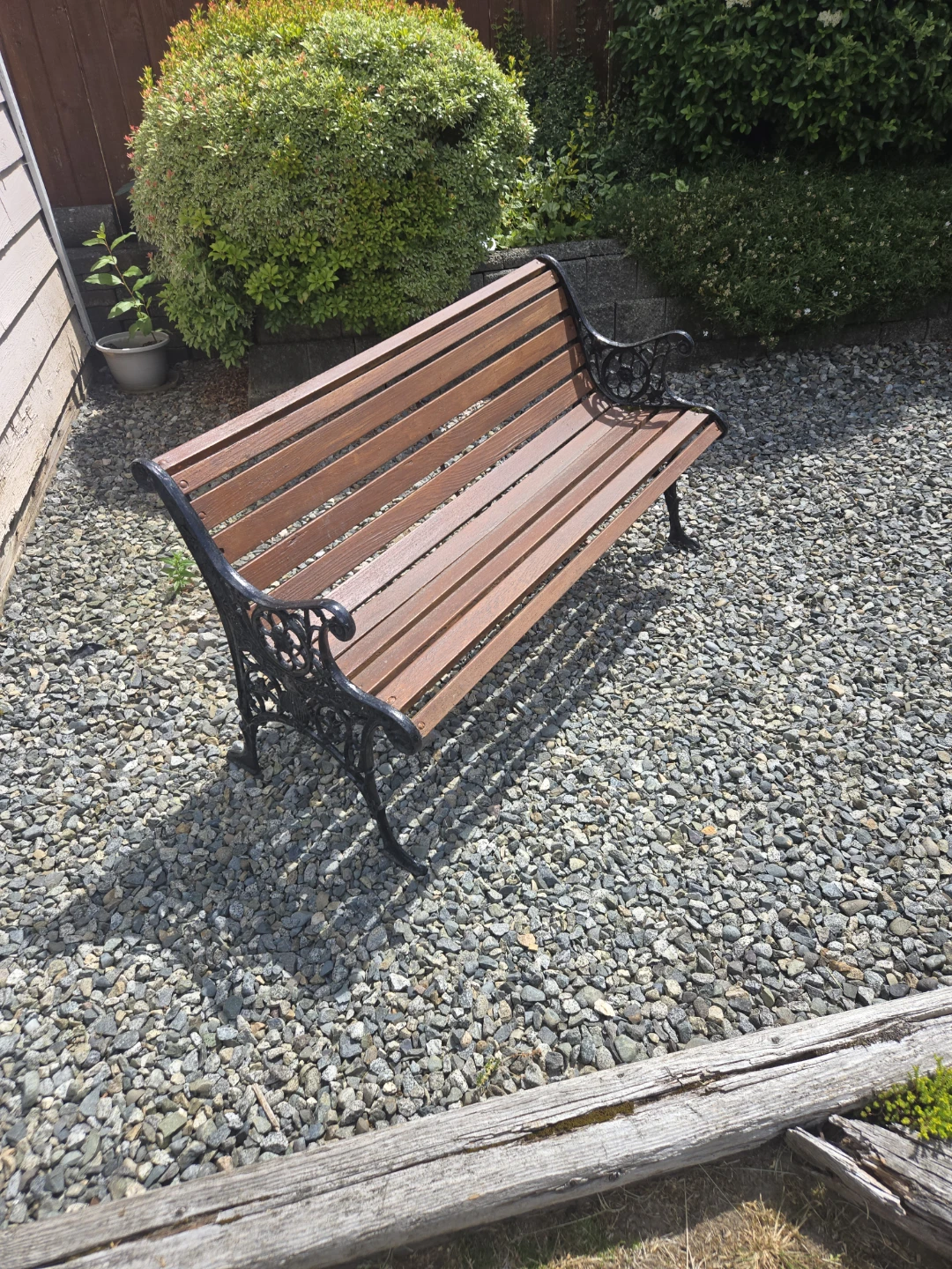 Ornate Garden Bench with Wooden Slats