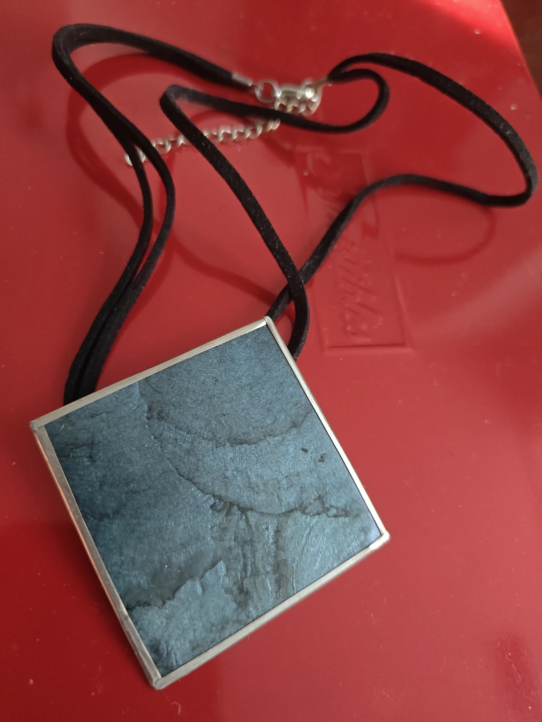 Square pendant necklace on black cord