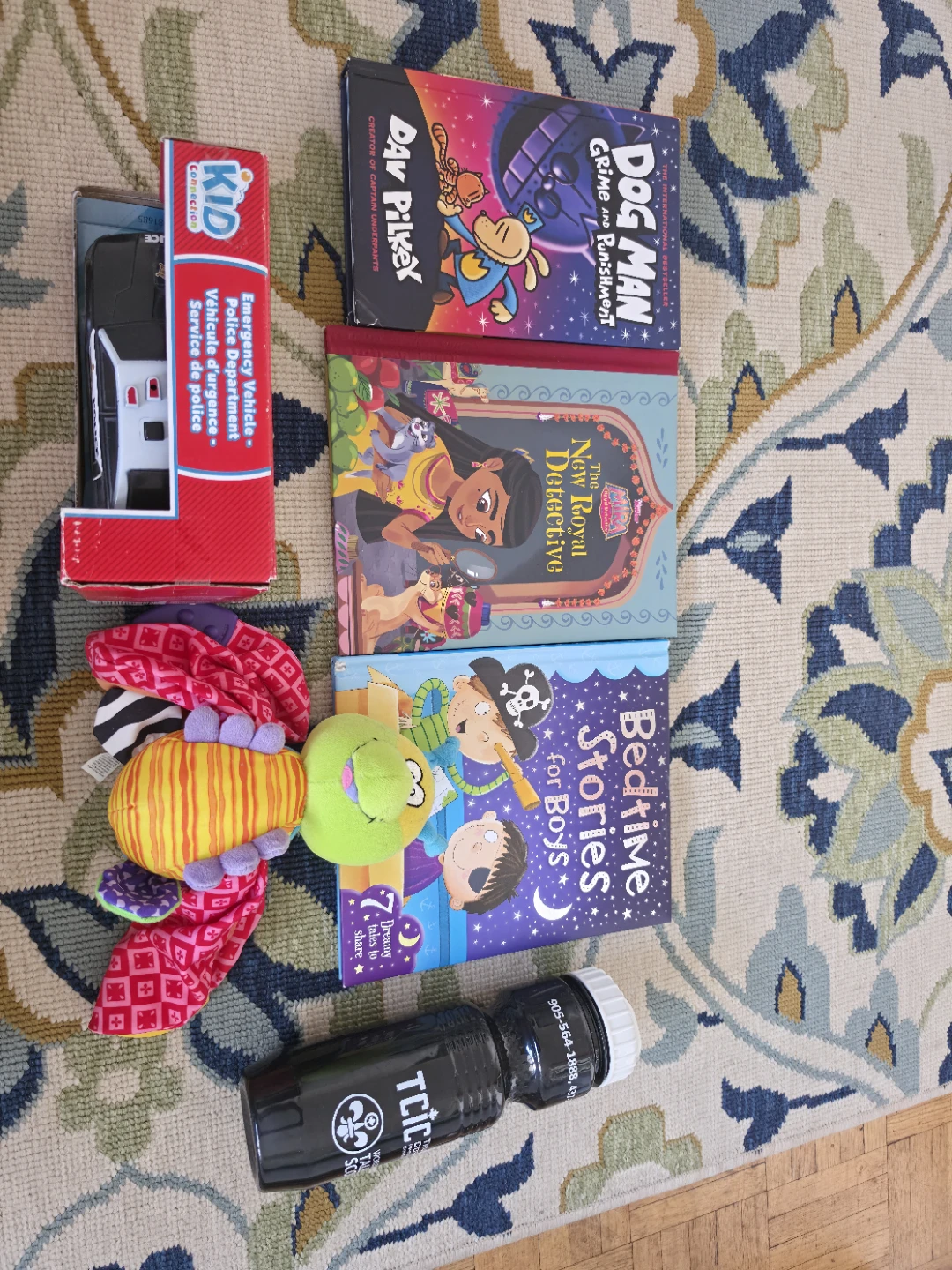 Kids books, soft toy, car, water bottle