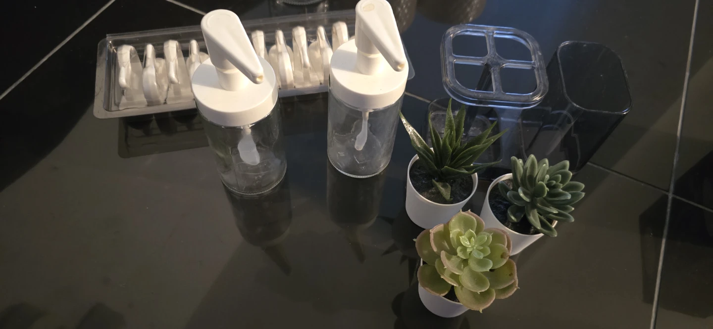 Ikea Glass Dispensers, plants, shower rings, toothbrush holder