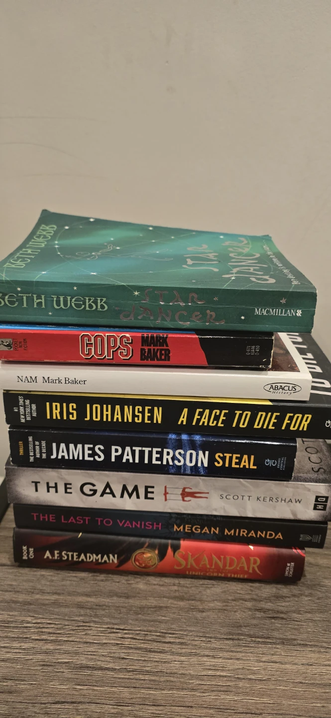 Stack of 8 books by various authors