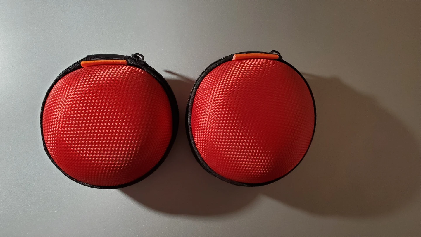 Two Red Round Zippered Cases
