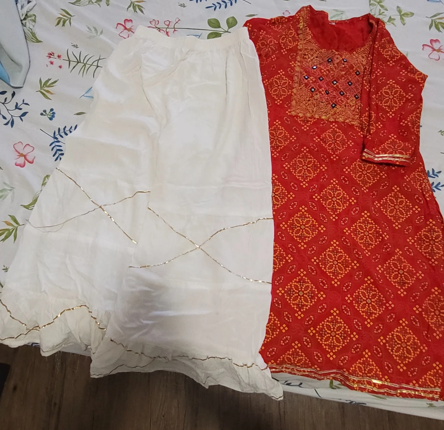 Red and white Indian outfit with gold trim