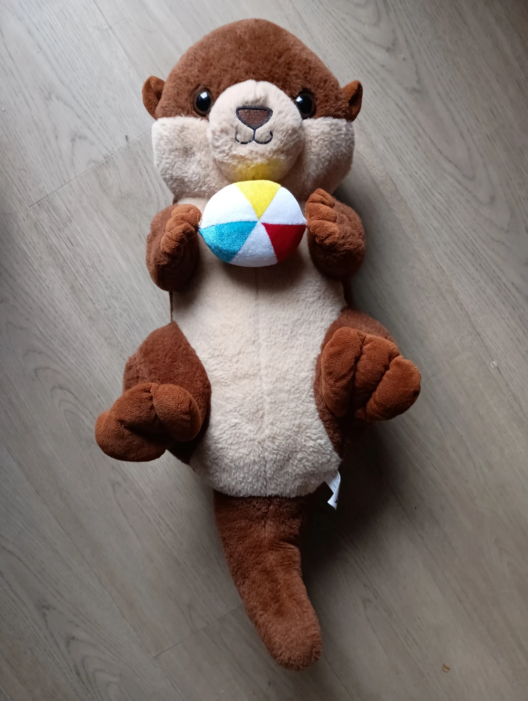 Plush Otter Holding Beach Ball