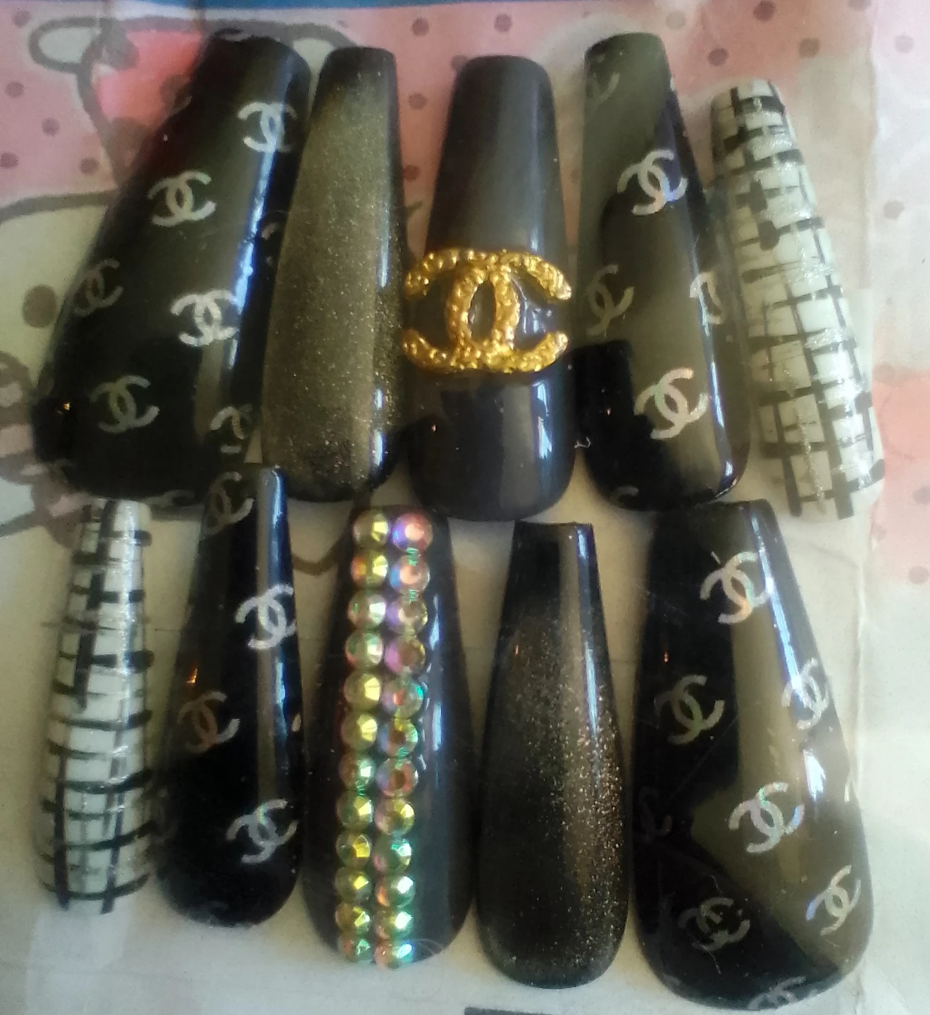 10 individual sets of designer inspired press-on nails