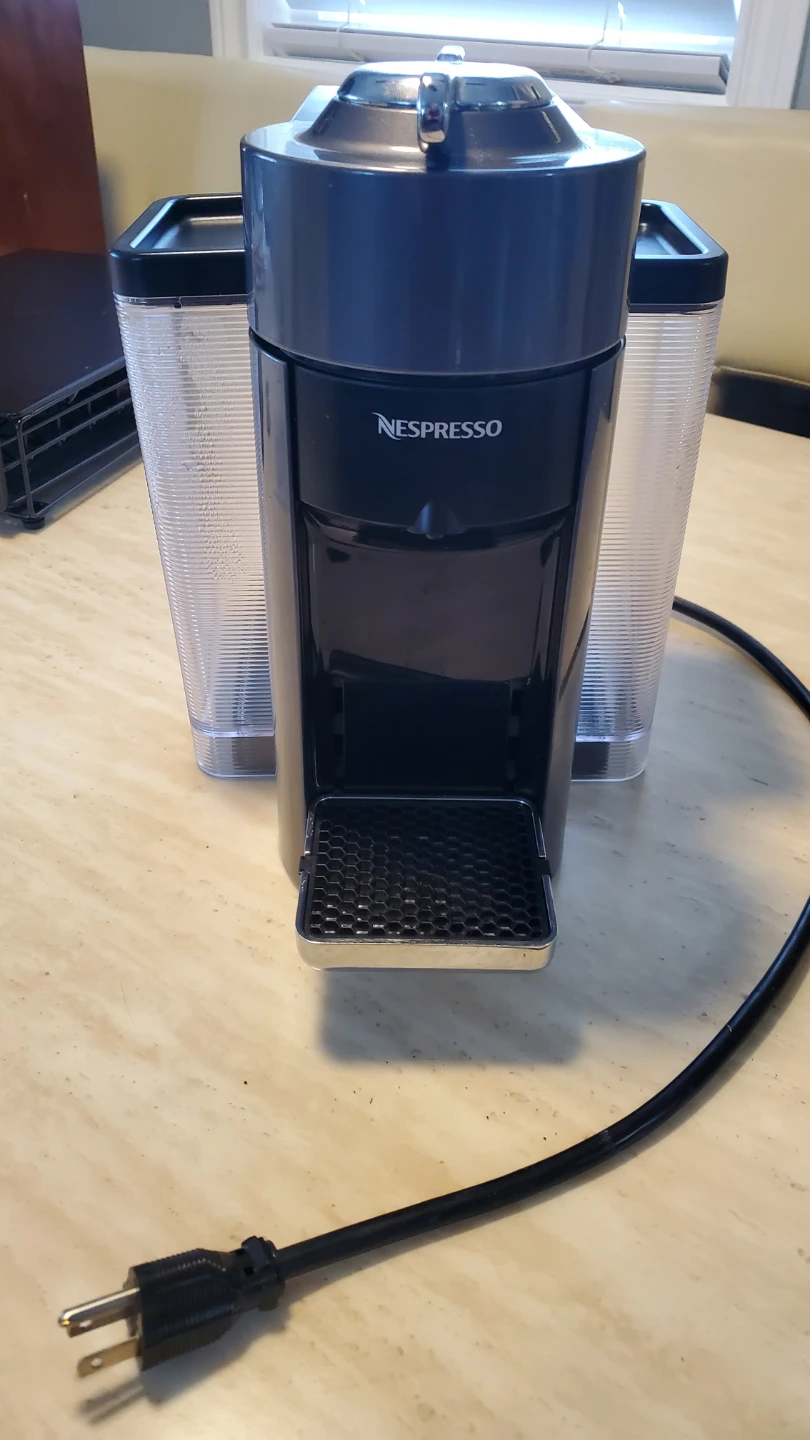 Nespresso GCC1 Coffee Maker, pod tray, and pods