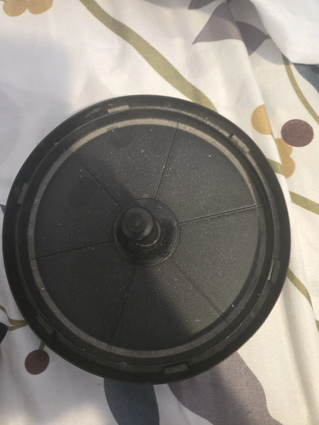 Black round plastic lid