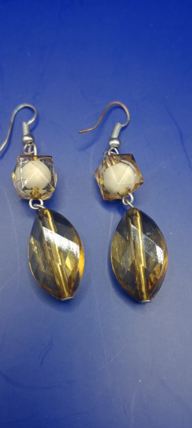 Amber and cream dangle earrings
