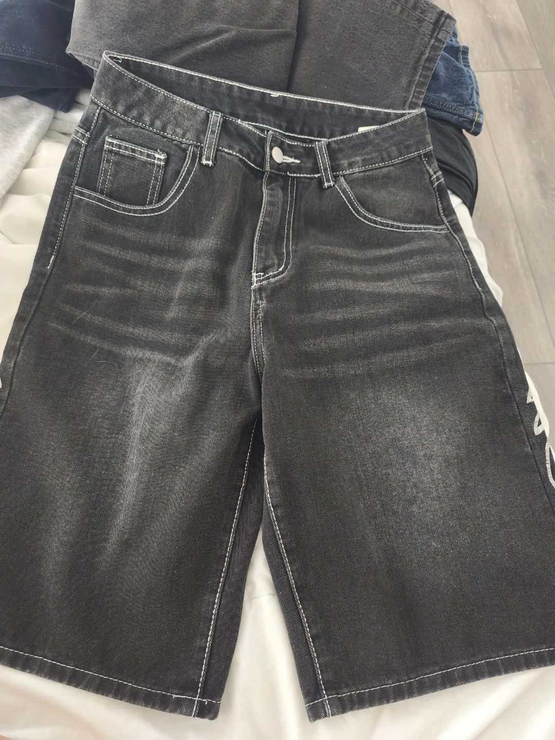 Black Denim Shorts with White Stitching and Embellishments