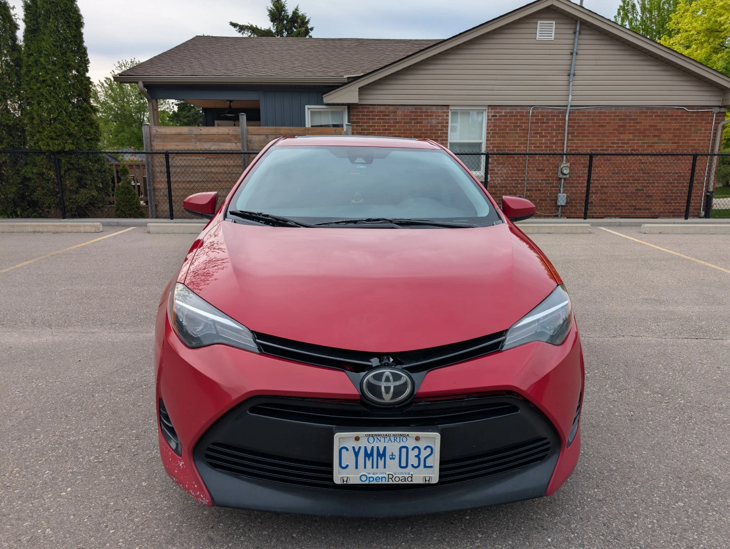 Red Toyota Corolla LE Sedan