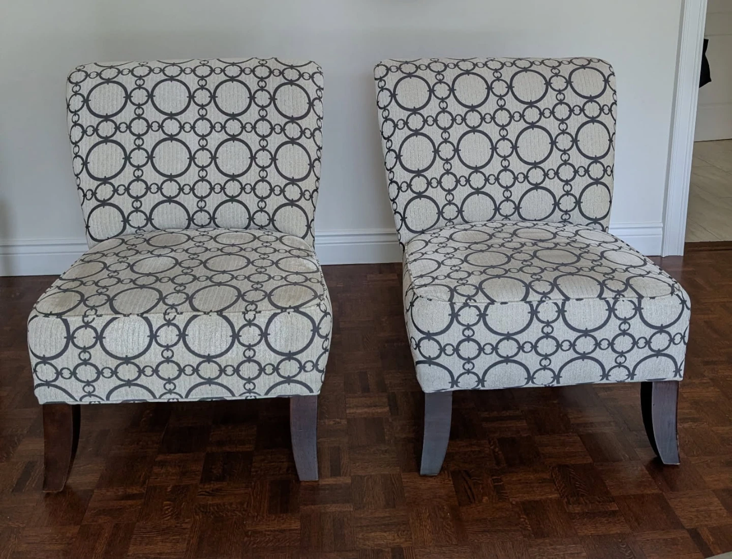 Two accent chairs with geometric pattern