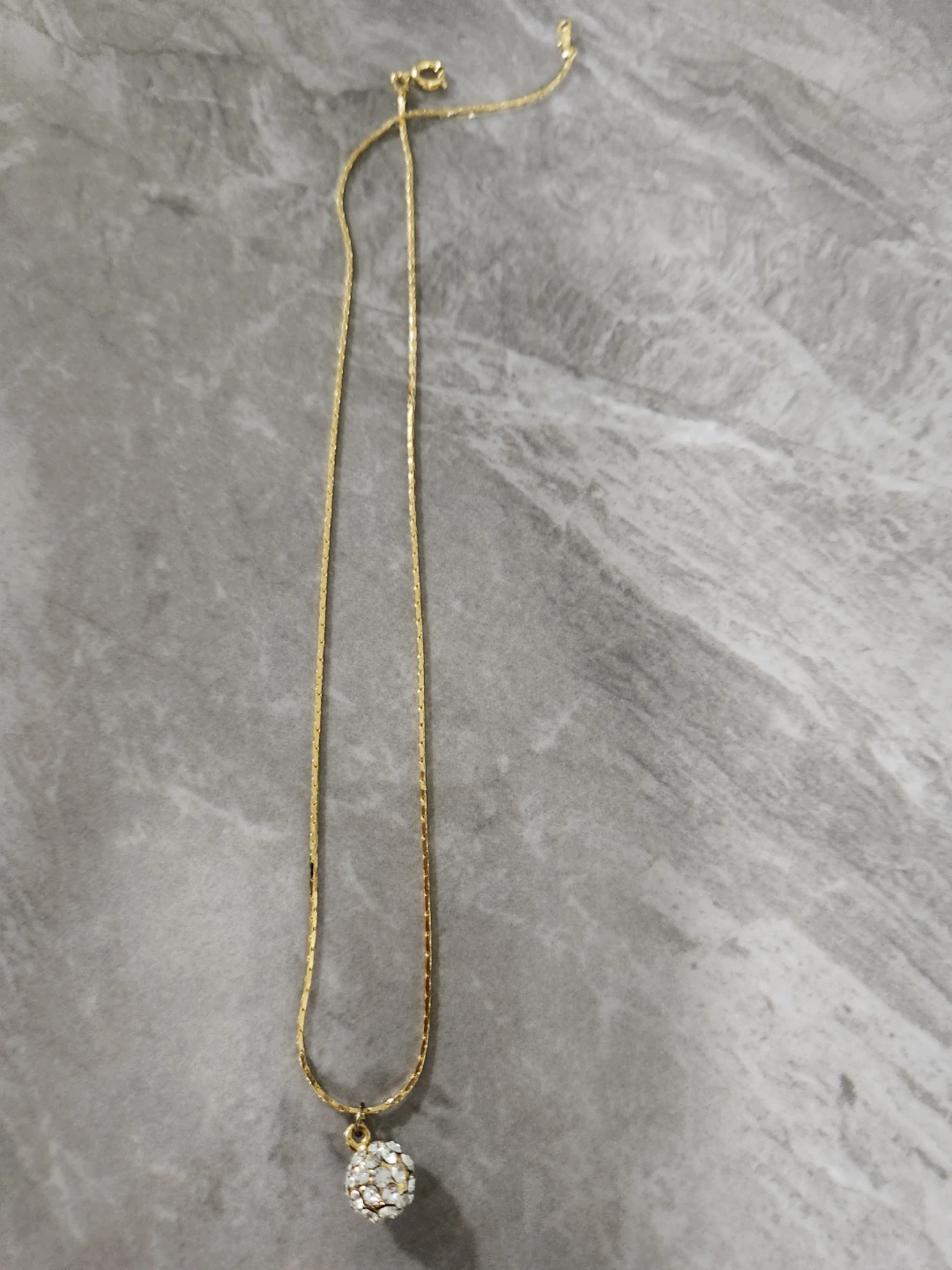 Gold-tone necklace with jeweled ball pendant - photo 2