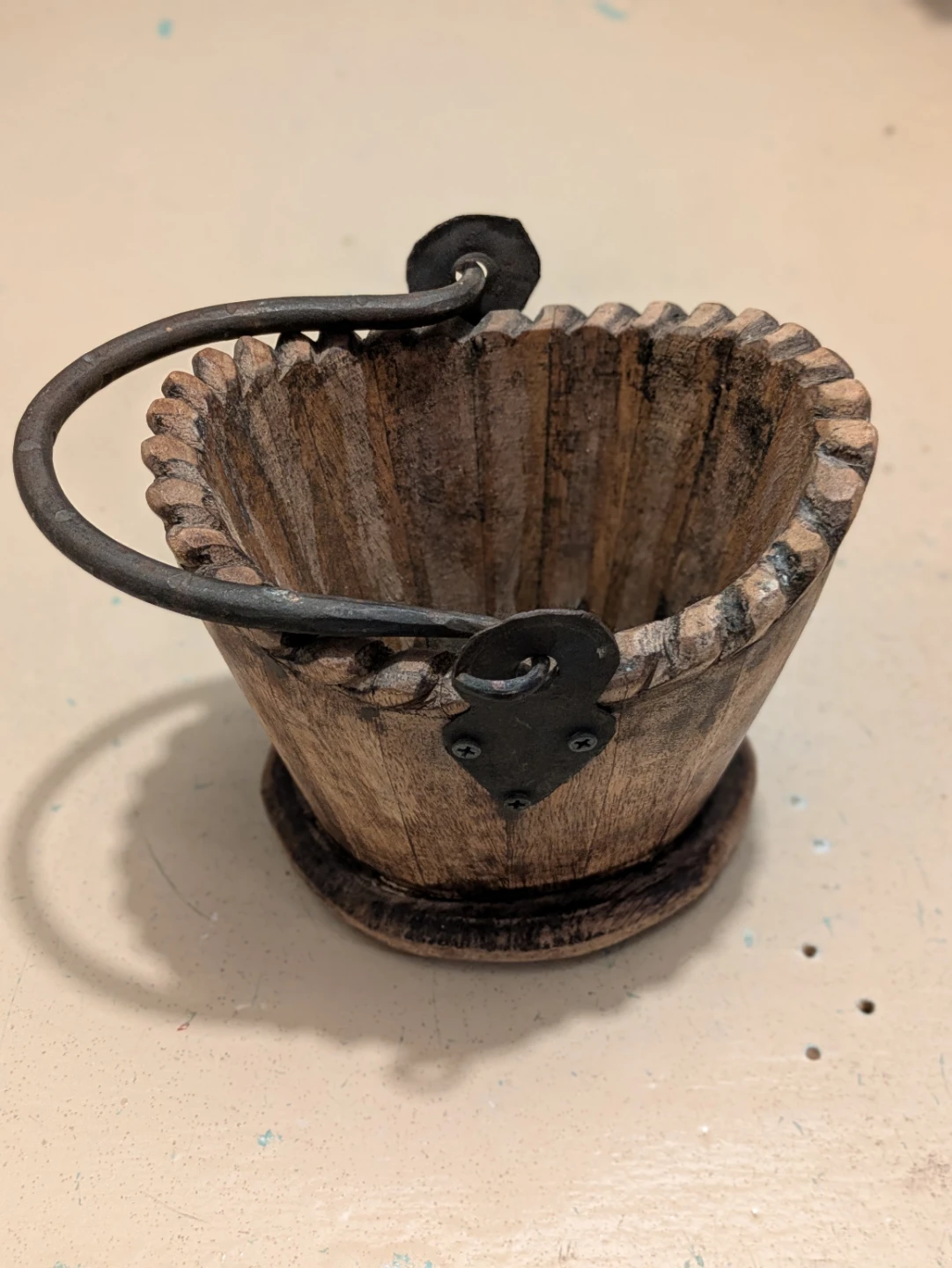 Rustic wooden bucket with metal handle