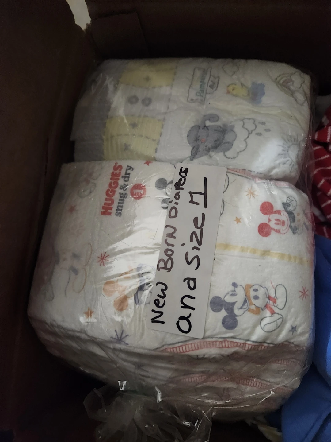 Baby Clothes and Huggies Diapers
