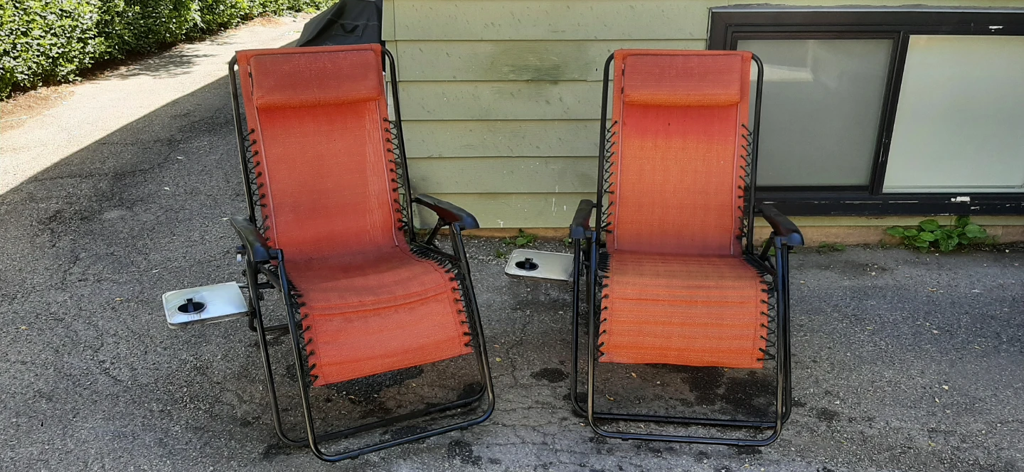 Pair Of Orange Zero Gravity Chairs With Cup Holders