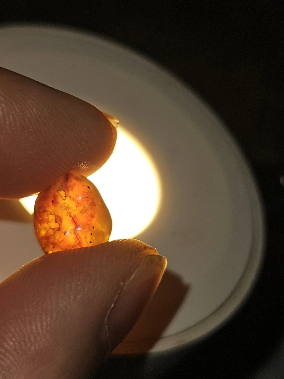 Gemstone lot - amber, dark gemstone, and diamond tester reading - photo 5