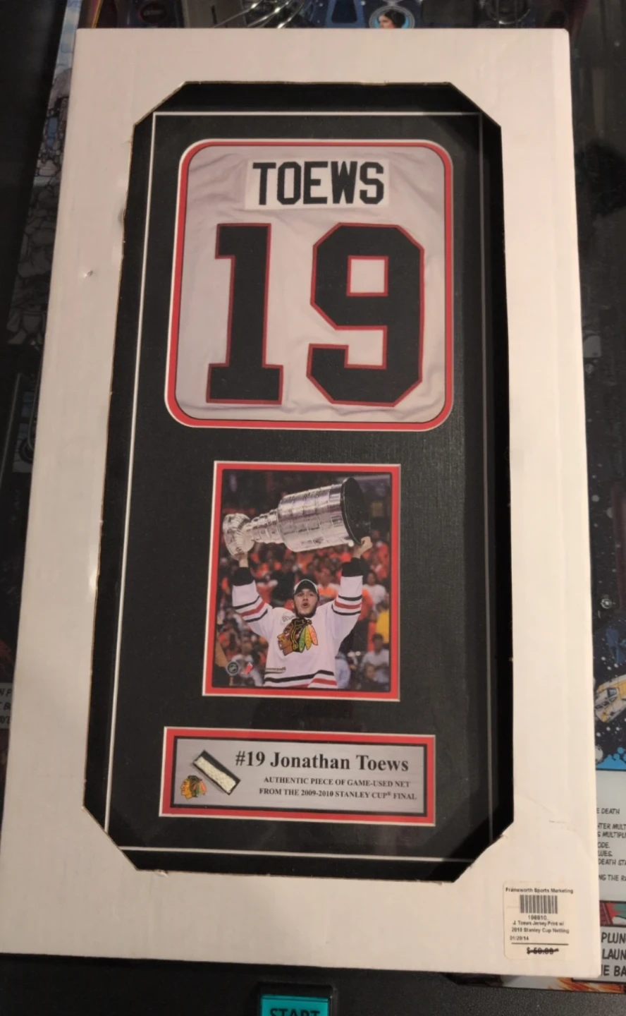 Jonathan Toews #19 Chicago Blackhawks Framed Jersey & Cup Net