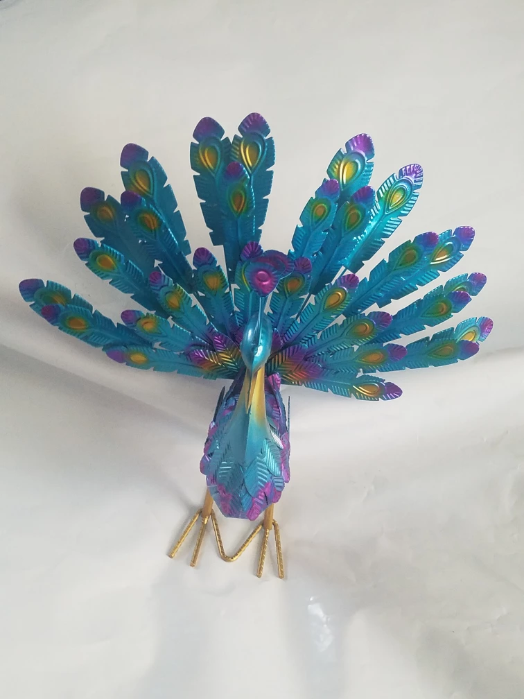 Decorative Metal Peacock outside statue