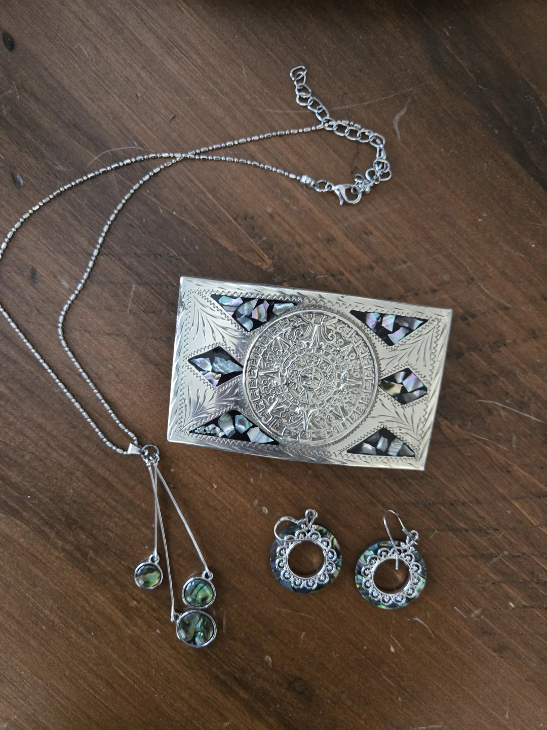 Alpaca Silver belt buckle with Aztec calendar and abalone inlay