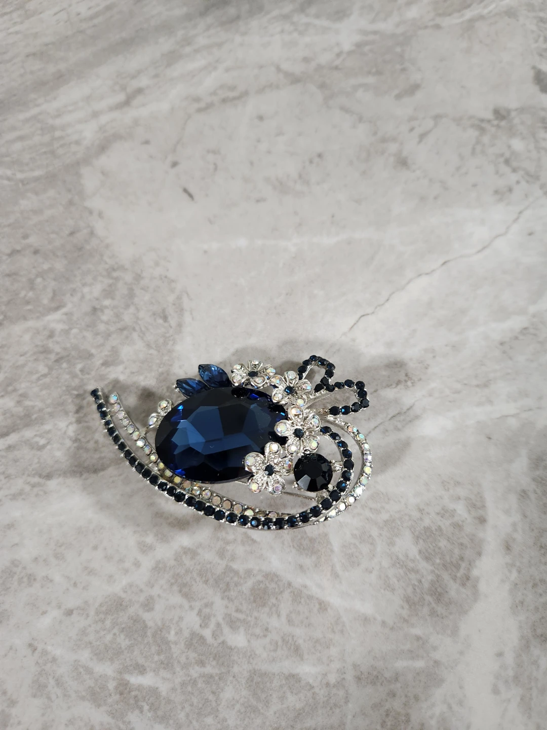 Blue Gem Brooch with Silver Flower Accents