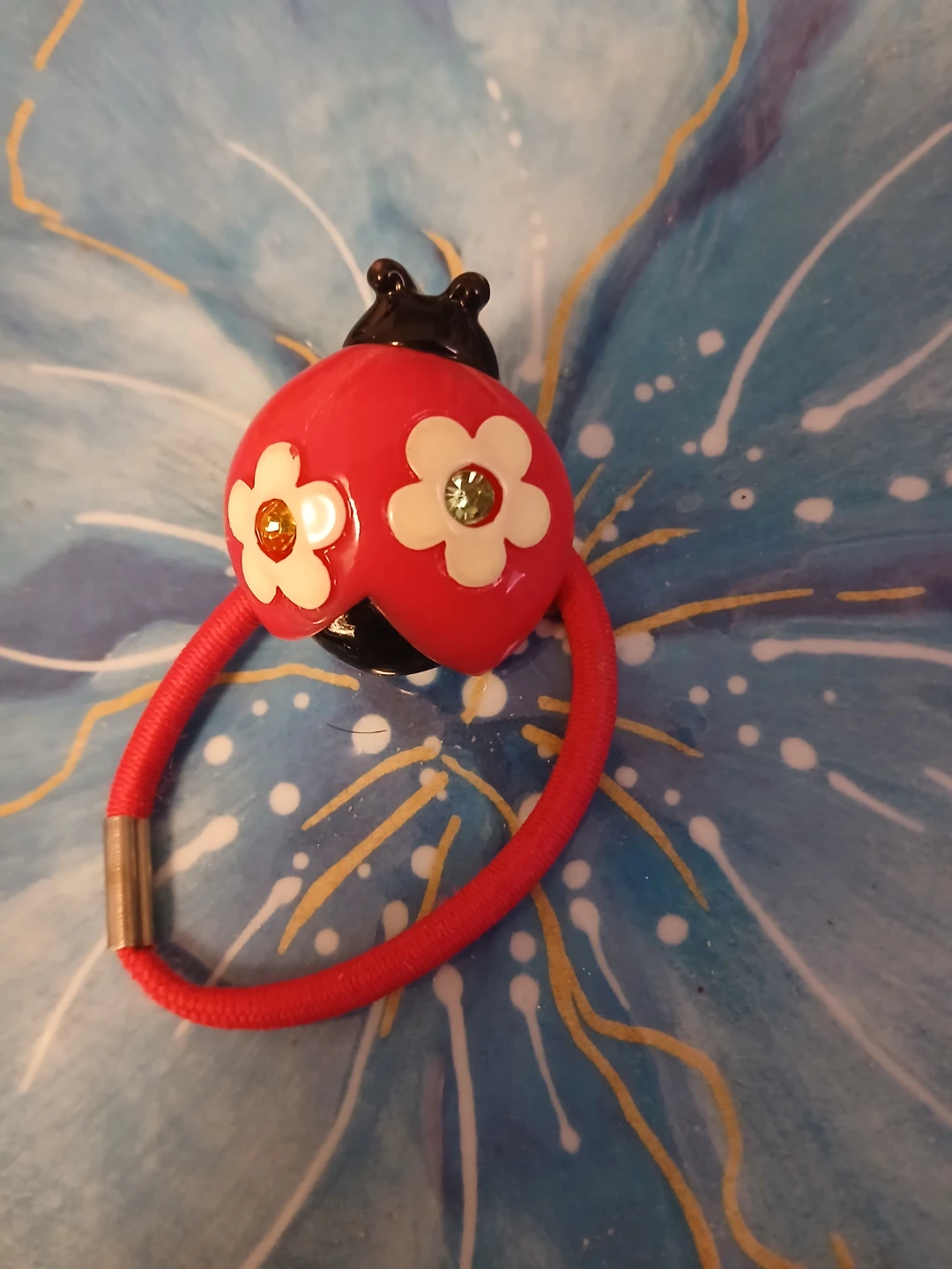 Large ladybug accessory on hairtie