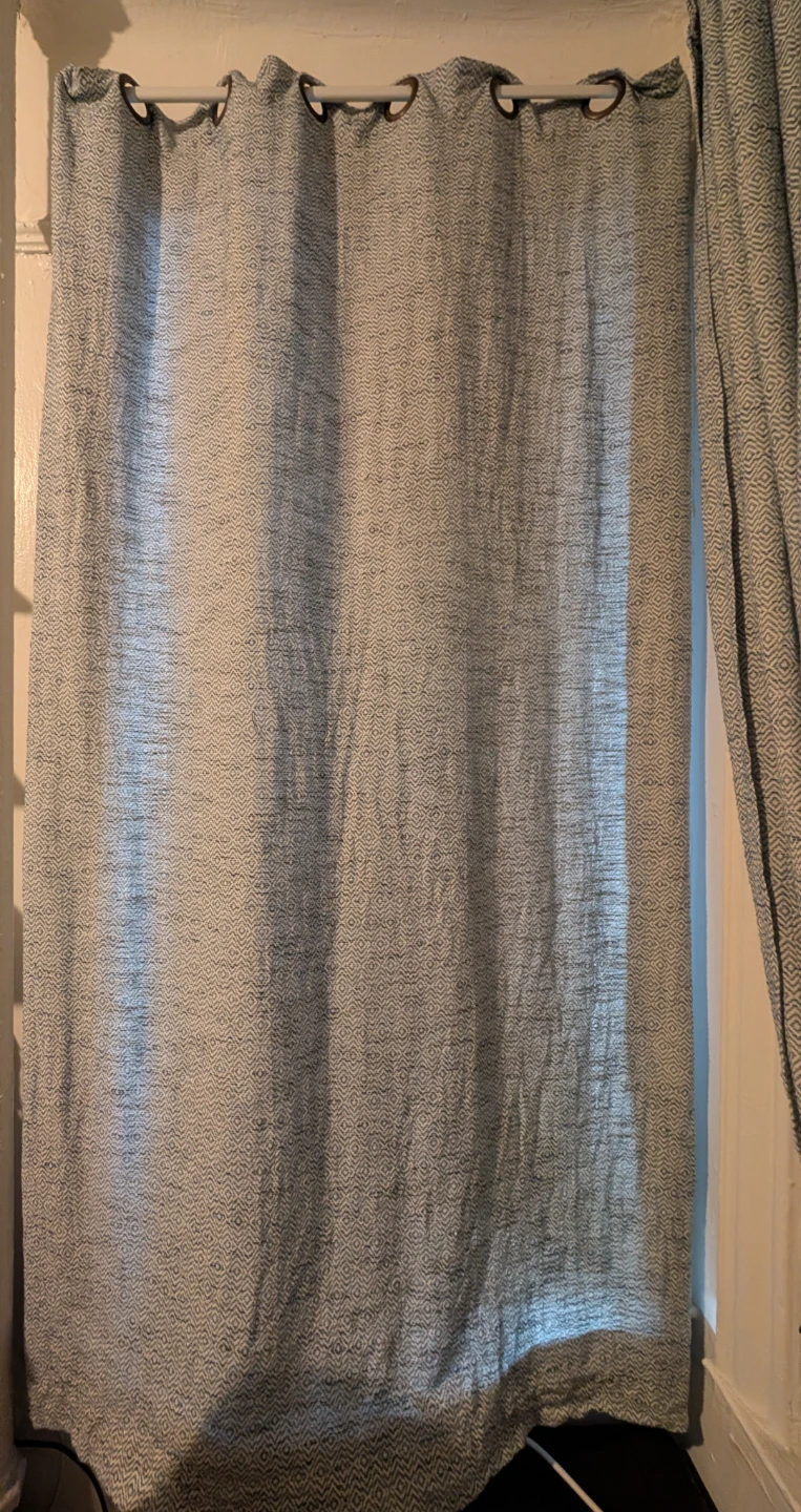 Two Blue and White Grommet Curtains