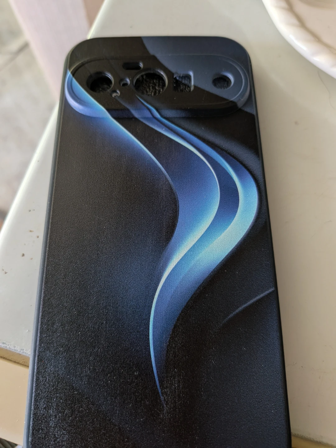 Black Phone Case With Blue Swirl Design