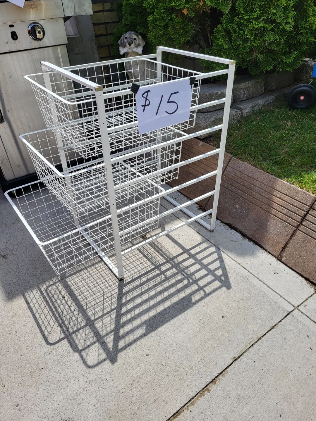 White wire shelving unit with 3 baskets