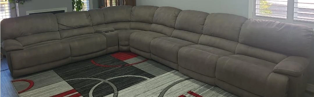 8 Piece large upgraded MicroSuede Reclining sectional .