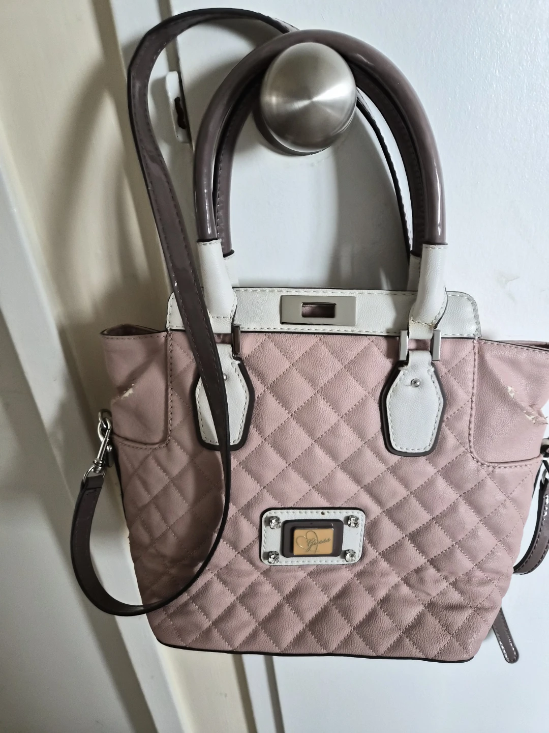 Guess handbag in pink quilted design.