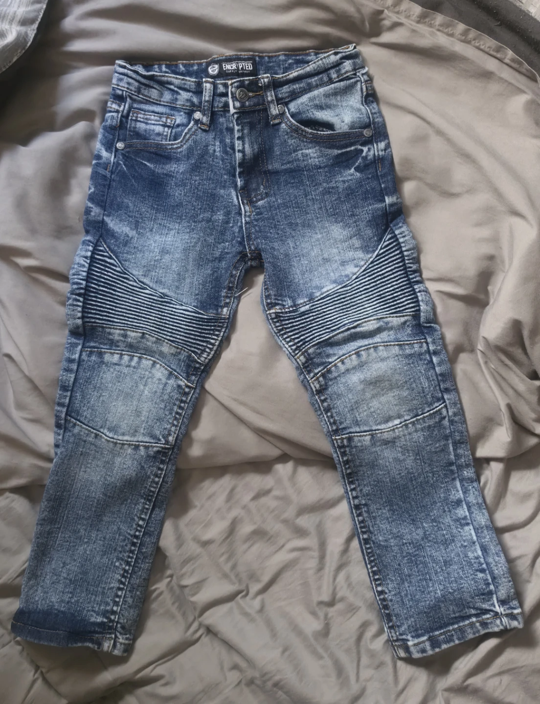 Encrypted Distressed Moto Jeans