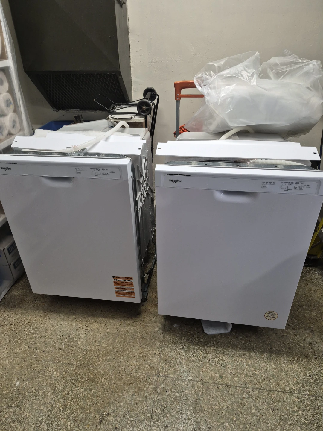 Two White Whirlpool Dishwashers