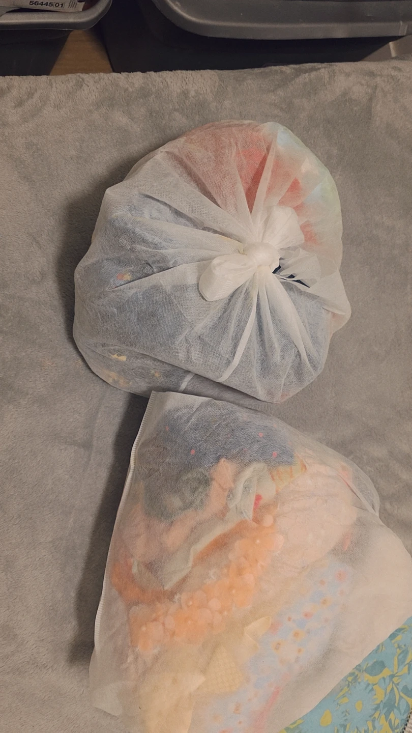 Two bags of baby clothes