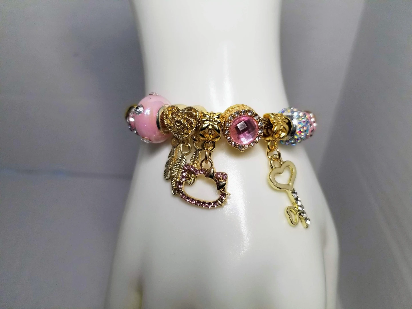 Gold Tone Charm Bracelet with Pink Hello Kitty Charm