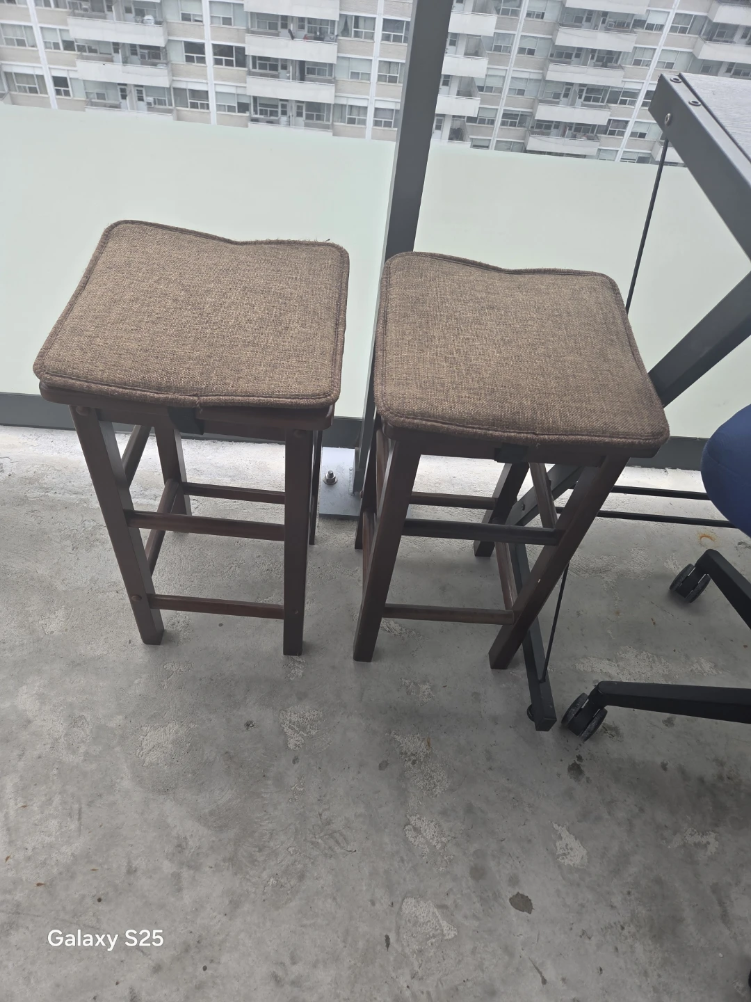 Two brown fabric bar stools