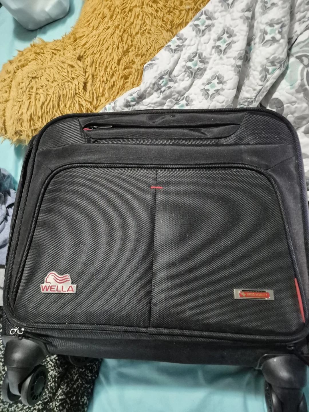 Swiss Mobility Black Rolling Suitcase with Wella Logo