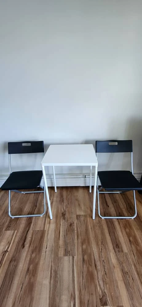 White Square Table and Black Folding Chairs Set