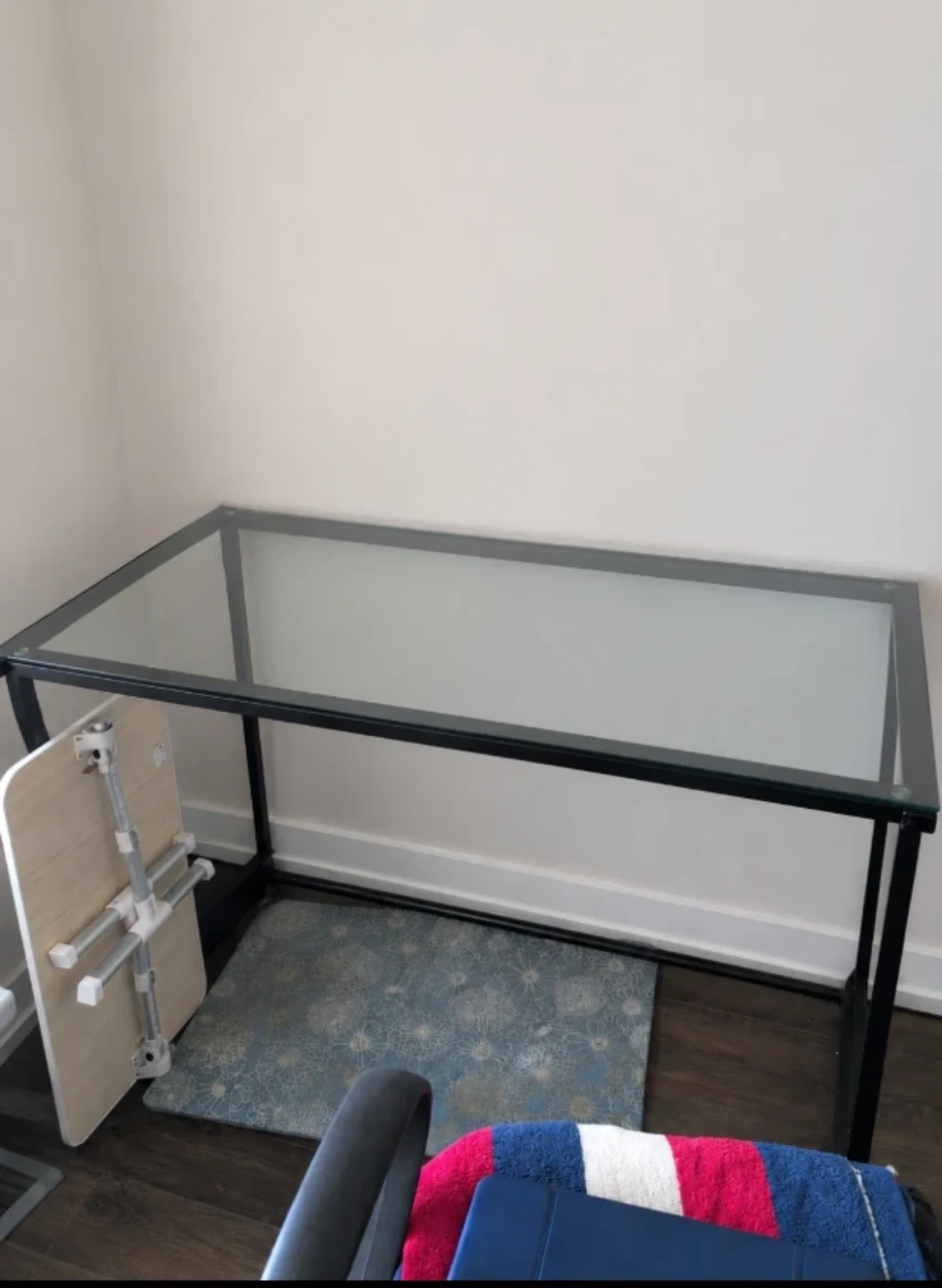 Glass top desk with black metal frame