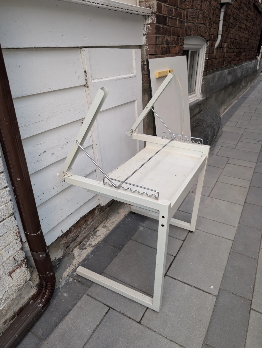 White drafting table with power outlet