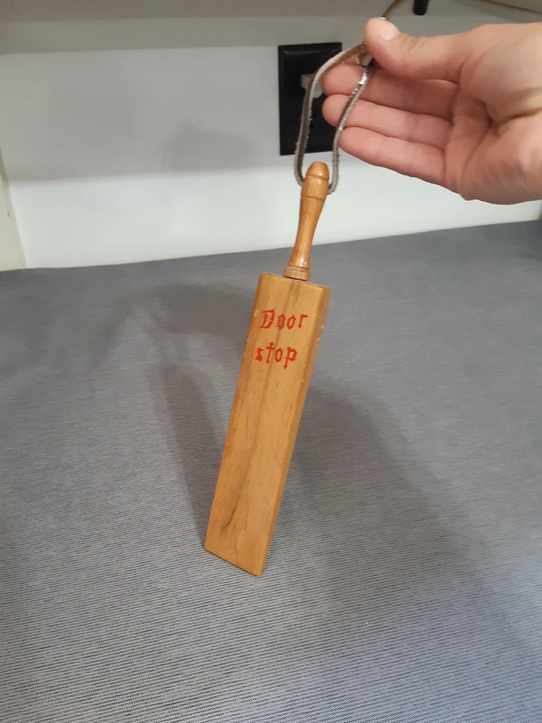 Vintage wooden wedge doorstop.