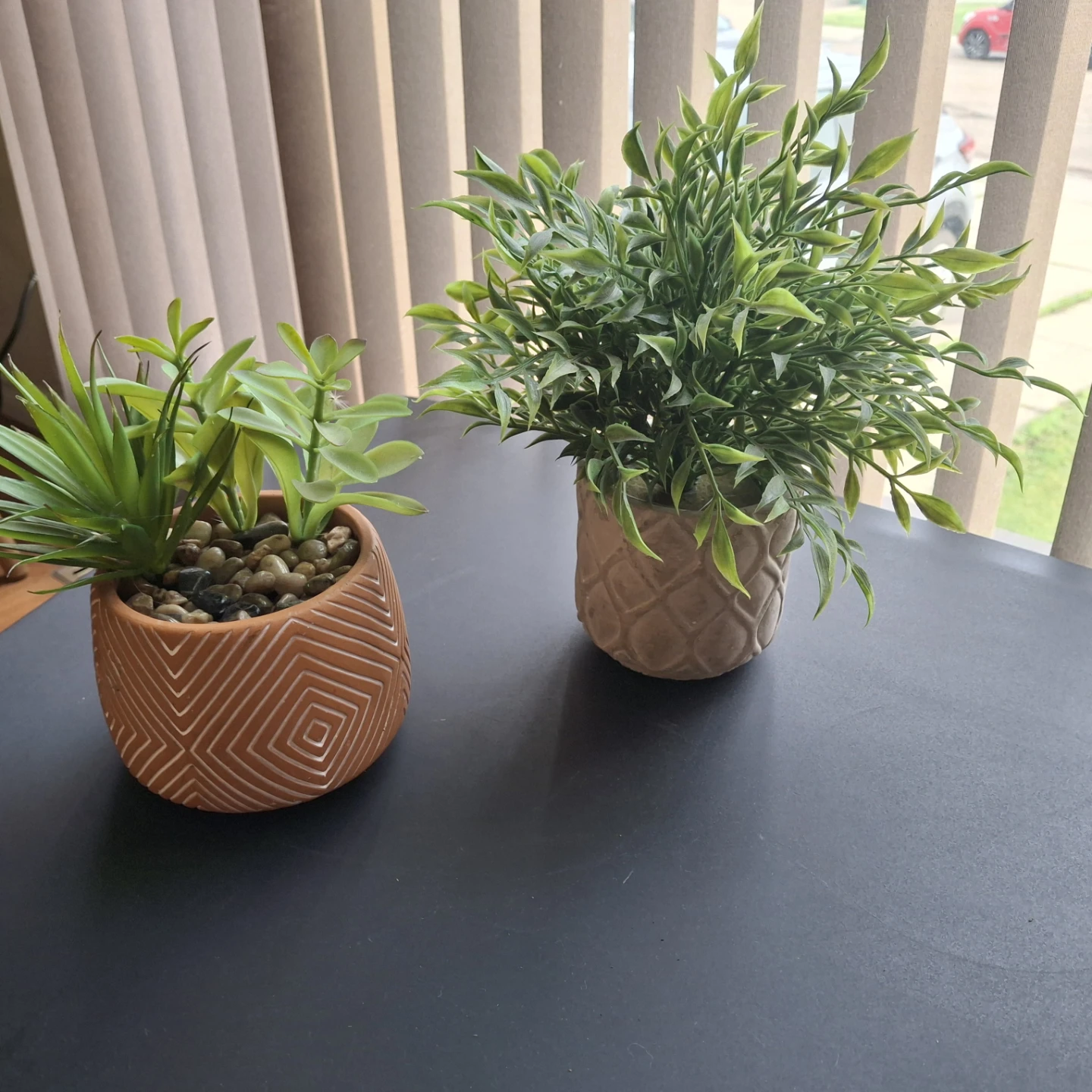 Two artificial potted plants $9 each