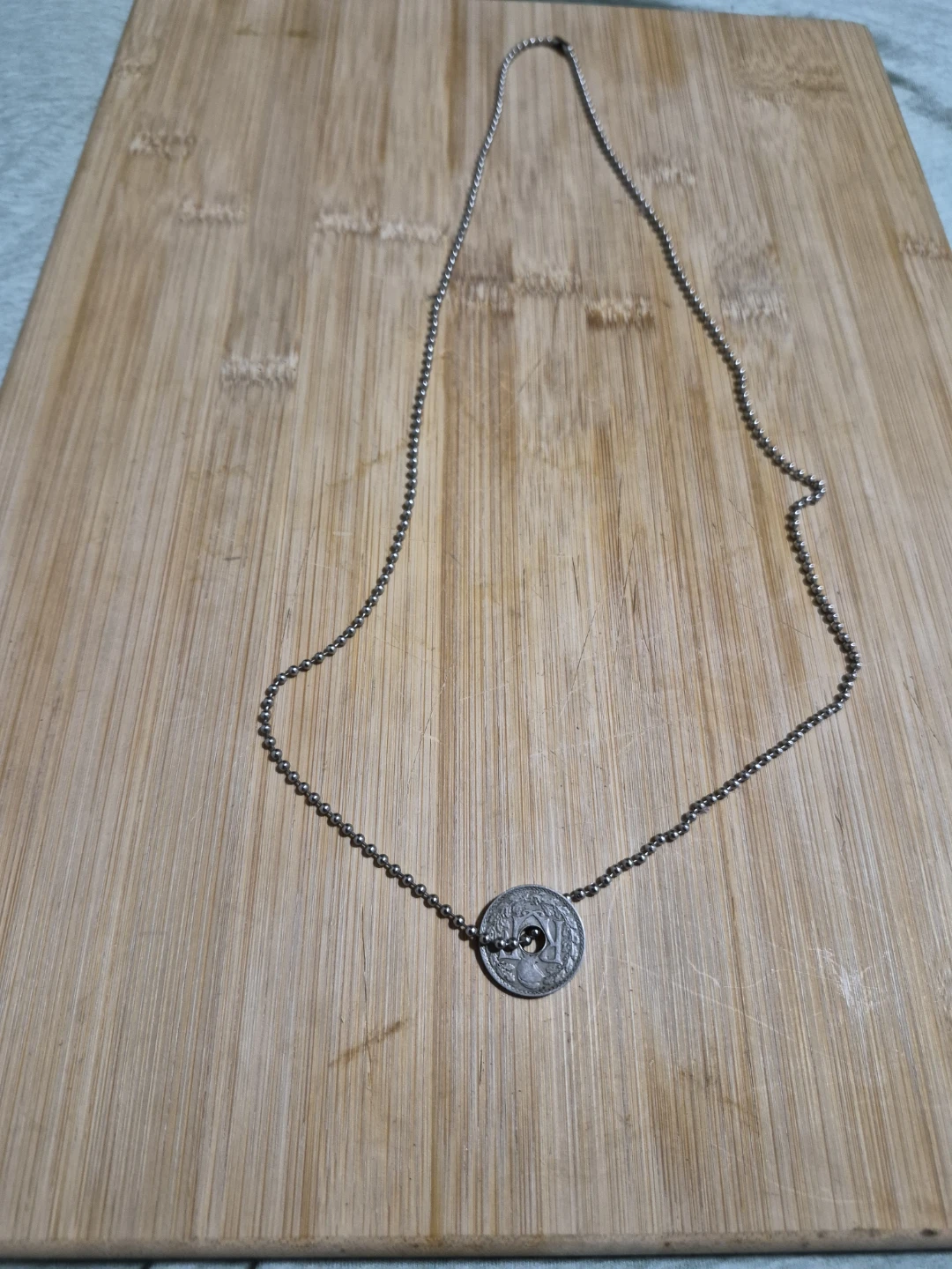 Silver ball chain necklace with coin pendant