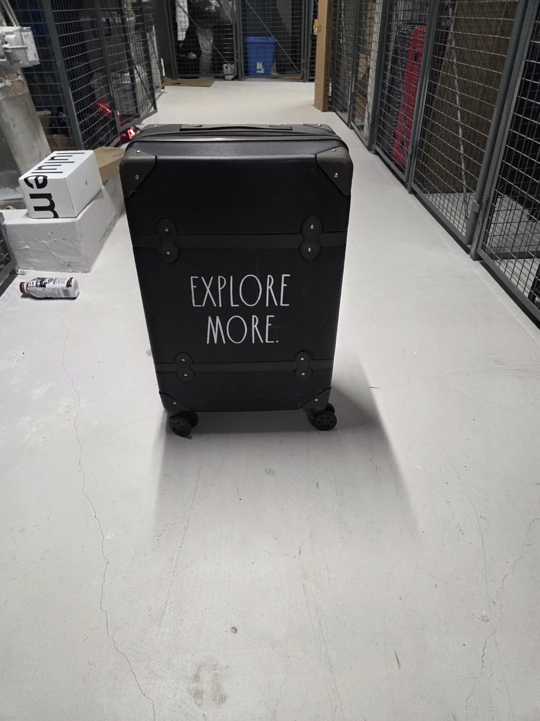 Black Suitcase with "EXPLORE MORE" graphic