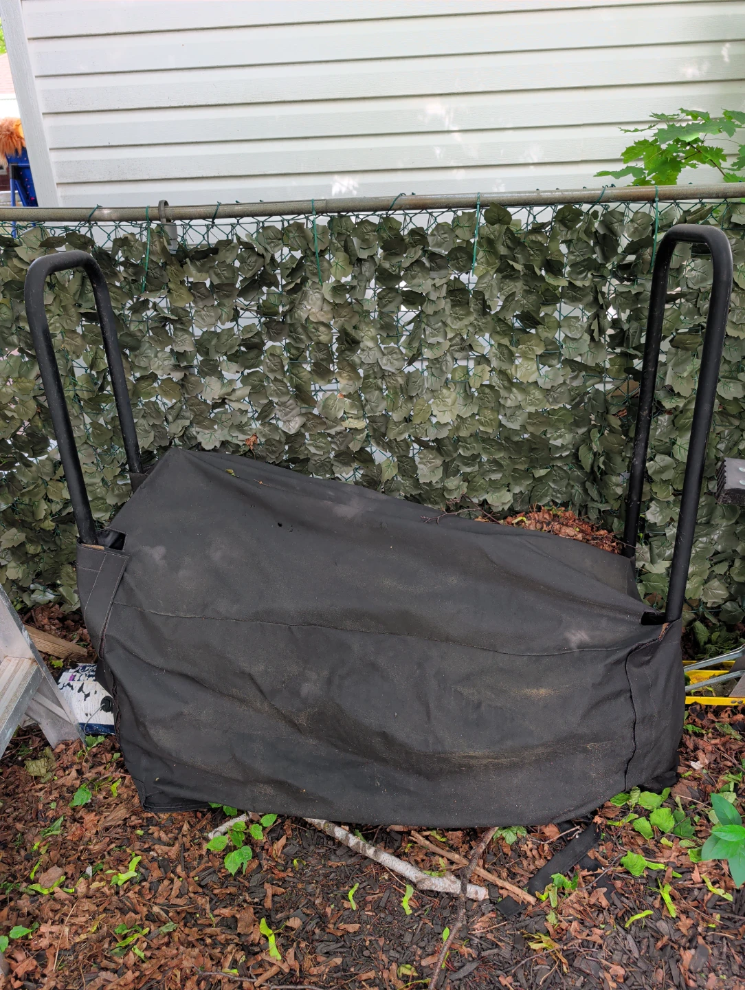 Firewood storage rack with velcro cover