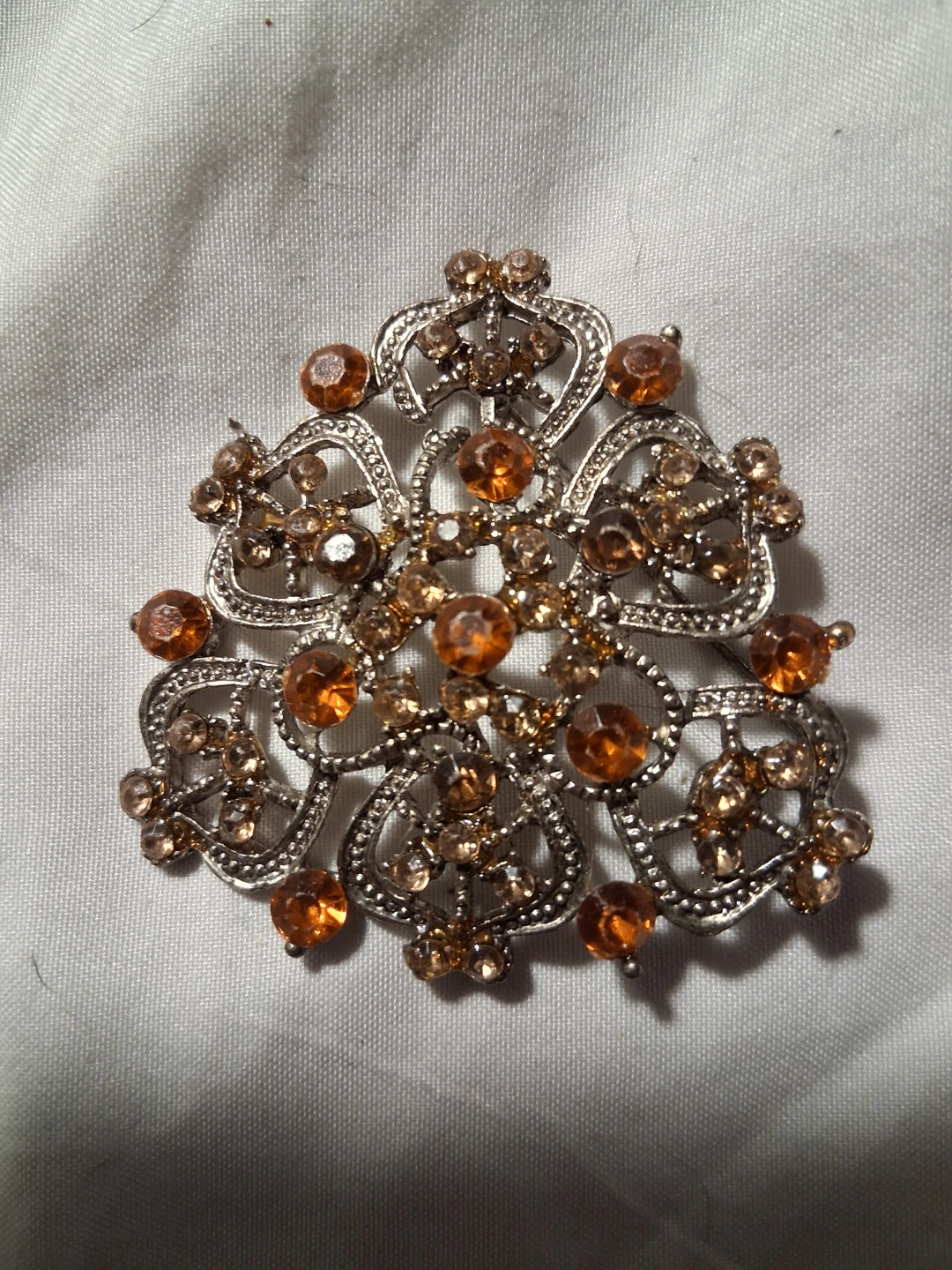 Silver Tone Brooch with Amber Rhinestones